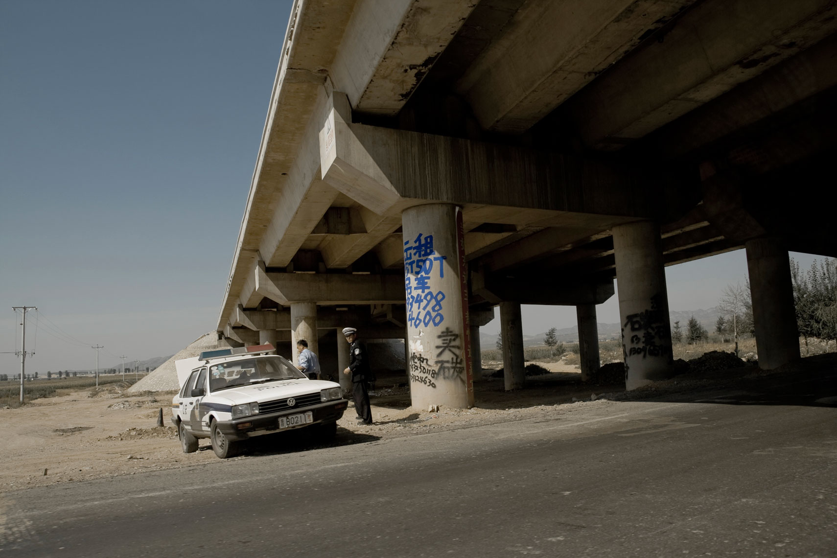CHINA. Shanxi Province, September 2012. A police patrol near the city of Datong, Shanxi Province.